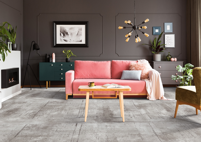 gray patterned carpet in living room with maximalist decor.